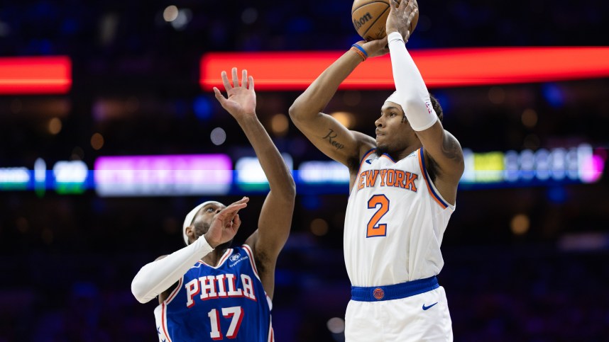 May 2, 2024; Philadelphia, Pennsylvania, USA; New York Knicks guard Miles McBride (2) shoots against Philadelphia 76ers guard Buddy Hield (17) during the first half of game six of the first round for the 2024 NBA playoffs at Wells Fargo Center. Mandatory Credit: Bill Streicher-Imagn Images