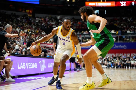 Jul 15, 2024; Las Vegas, NV, USA; Los Angeles Lakers guard Bronny James (9) dribbles the ball against Boston Celtics forward Anton Watson (28) during the first half at Thomas & Mack Center. Mandatory Credit: Lucas Peltier-Imagn Images