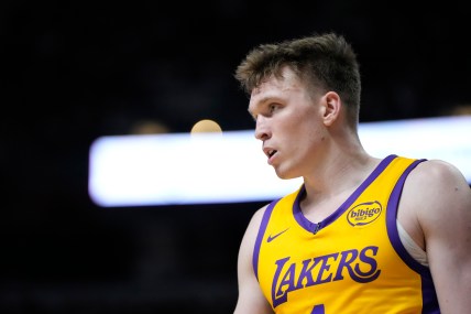 Jul 12, 2024; Las Vegas, NV, USA;  Los Angeles Lakers forward Dalton Knecht (4) competes during the first half against the Houston Rockets at the Thomas & Mack Center. Mandatory Credit: Lucas Peltier-Imagn Images