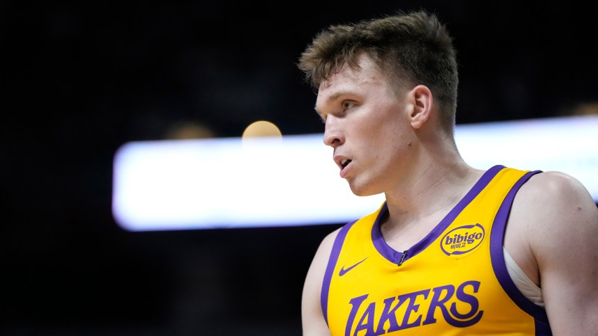 Jul 12, 2024; Las Vegas, NV, USA;  Los Angeles Lakers forward Dalton Knecht (4) competes during the first half against the Houston Rockets at the Thomas & Mack Center. Mandatory Credit: Lucas Peltier-Imagn Images