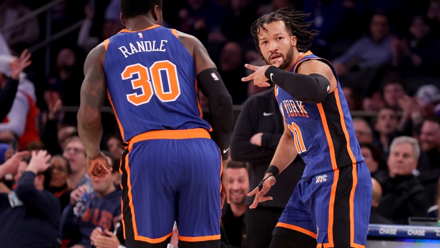 Jan 20, 2024; New York, New York, USA; New York Knicks guard Jalen Brunson (11) celebrates his three point shot against the Toronto Raptors with forward Julius Randle (30) during the first quarter at Madison Square Garden. Mandatory Credit: Brad Penner-Imagn Images