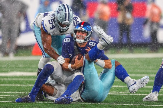 Sep 10, 2023; East Rutherford, New Jersey, USA; New York Giants quarterback Daniel Jones (8) is sacked by Dallas Cowboys linebacker Micah Parsons (11) during the second half at MetLife Stadium. Mandatory Credit: Ed Mulholland-Imagn Images