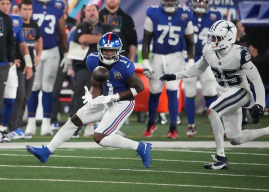 Sep 26, 2024; East Rutherford, New Jersey, USA;  New York Giants wide receiver Malik Nabers (1) gathers in a pass in front of Dallas Cowboys cornerback Andrew Booth Jr. (25) in the first half at MetLife Stadium. Mandatory Credit: Robert Deutsch-Imagn Images