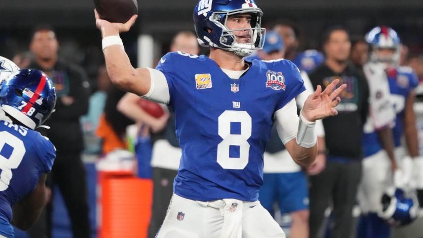 Sep 26, 2024; East Rutherford, New Jersey, USA;  New York Giants quarterback Daniel Jones (8) throws against the Dallas defense during the first half at MetLife Stadium. Mandatory Credit: Robert Deutsch-Imagn Images