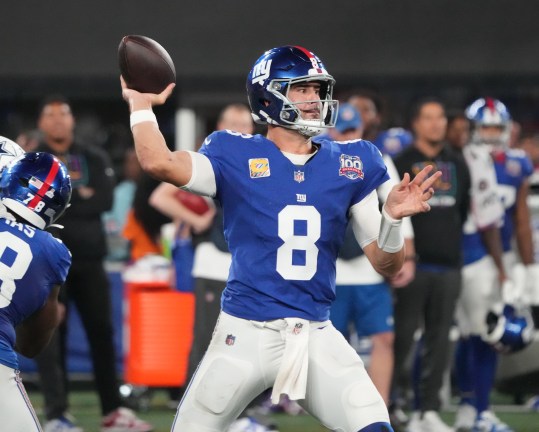 Sep 26, 2024; East Rutherford, New Jersey, USA;  New York Giants quarterback Daniel Jones (8) throws against the Dallas defense during the first half at MetLife Stadium. Mandatory Credit: Robert Deutsch-Imagn Images