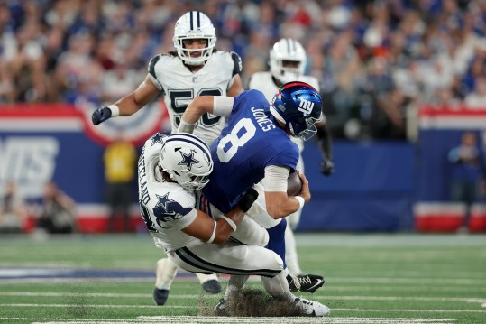 Sep 26, 2024; East Rutherford, New Jersey, USA; Dallas Cowboys defensive end Marshawn Kneeland (94) sacks New York Giants quarterback Daniel Jones (8) during the third quarter at MetLife Stadium. Mandatory Credit: Brad Penner-Imagn Images