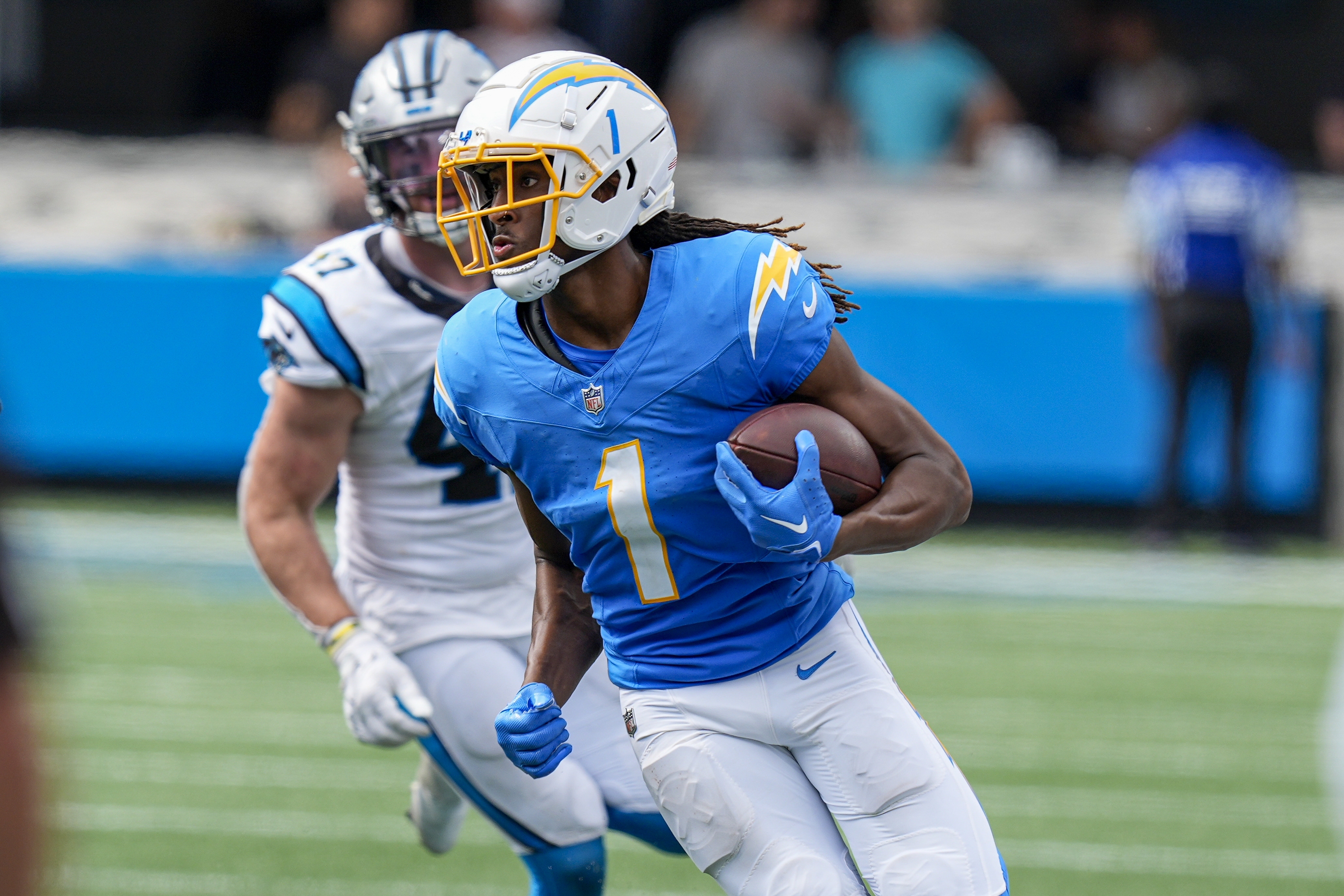 Sep 15, 2024; Charlotte, North Carolina, USA; Los Angeles Chargers wide receiver Quentin Johnston (1) runs against the Carolina Panthers during the second half at Bank of America Stadium. Mandatory Credit: Jim Dedmon-Imagn Images