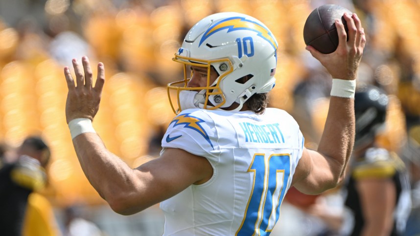 Sep 22, 2024; Pittsburgh, Pennsylvania, USA; Los Angeles Chargers quarterback Justin Herbert (10) works out before a game against the Pittsburgh Steelers at Acrisure Stadium. Mandatory Credit: Barry Reeger-Imagn Images