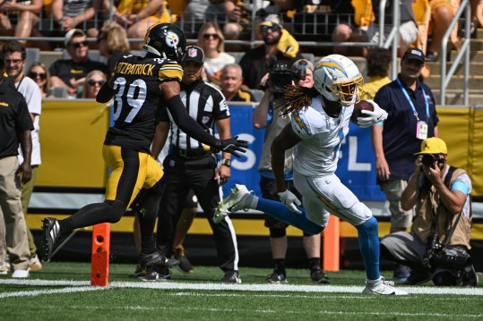 Sep 22, 2024; Pittsburgh, Pennsylvania, USA; Los Angeles Chargers wide receiver Quentin Johnston (1) scores a touchdown while being chased by Pittsburgh Steelers safety Minkah Fitzpatrick (39) during the first quarter at Acrisure Stadium. Mandatory Credit: Barry Reeger-Imagn Images