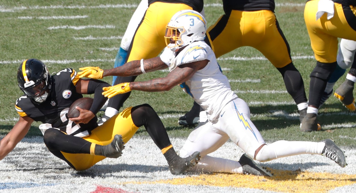 Sep 22, 2024; Pittsburgh, Pennsylvania, USA;  Los Angeles Chargers safety Derwin James Jr. (3) sacks Pittsburgh Steelers quarterback Justin Fields (2) during the third quarter at Acrisure Stadium. Pittsburgh won 20-10. Mandatory Credit: Charles LeClaire-Imagn Images