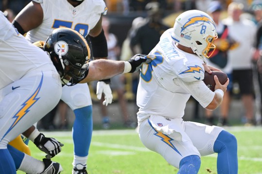 Sep 22, 2024; Pittsburgh, Pennsylvania, USA; PPittsburgh Steelers defensive tackle Cameron Heyward (97) sacks Los Angeles Chargers quarterback Taylor Heinicke (8) during the fourth quarter at Acrisure Stadium. Mandatory Credit: Barry Reeger-Imagn Images