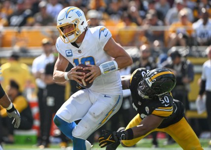 Sep 22, 2024; Pittsburgh, Pennsylvania, USA; Pittsburgh Steelers linebacker Elandon Roberts (50) sacks Los Angeles Chargers quarterback Justin Herbert (10) during the third quarter at Acrisure Stadium. Mandatory Credit: Barry Reeger-Imagn Images