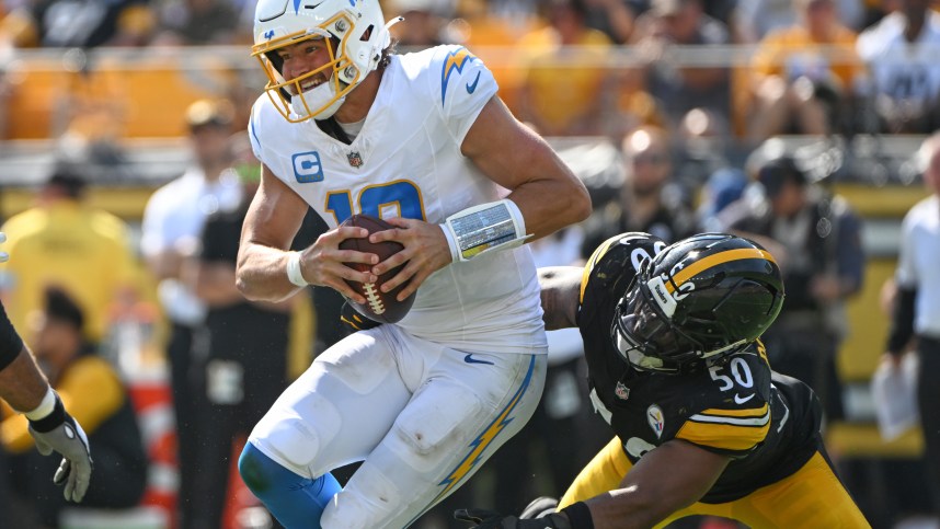 Sep 22, 2024; Pittsburgh, Pennsylvania, USA; Pittsburgh Steelers linebacker Elandon Roberts (50) sacks Los Angeles Chargers quarterback Justin Herbert (10) during the third quarter at Acrisure Stadium. Mandatory Credit: Barry Reeger-Imagn Images