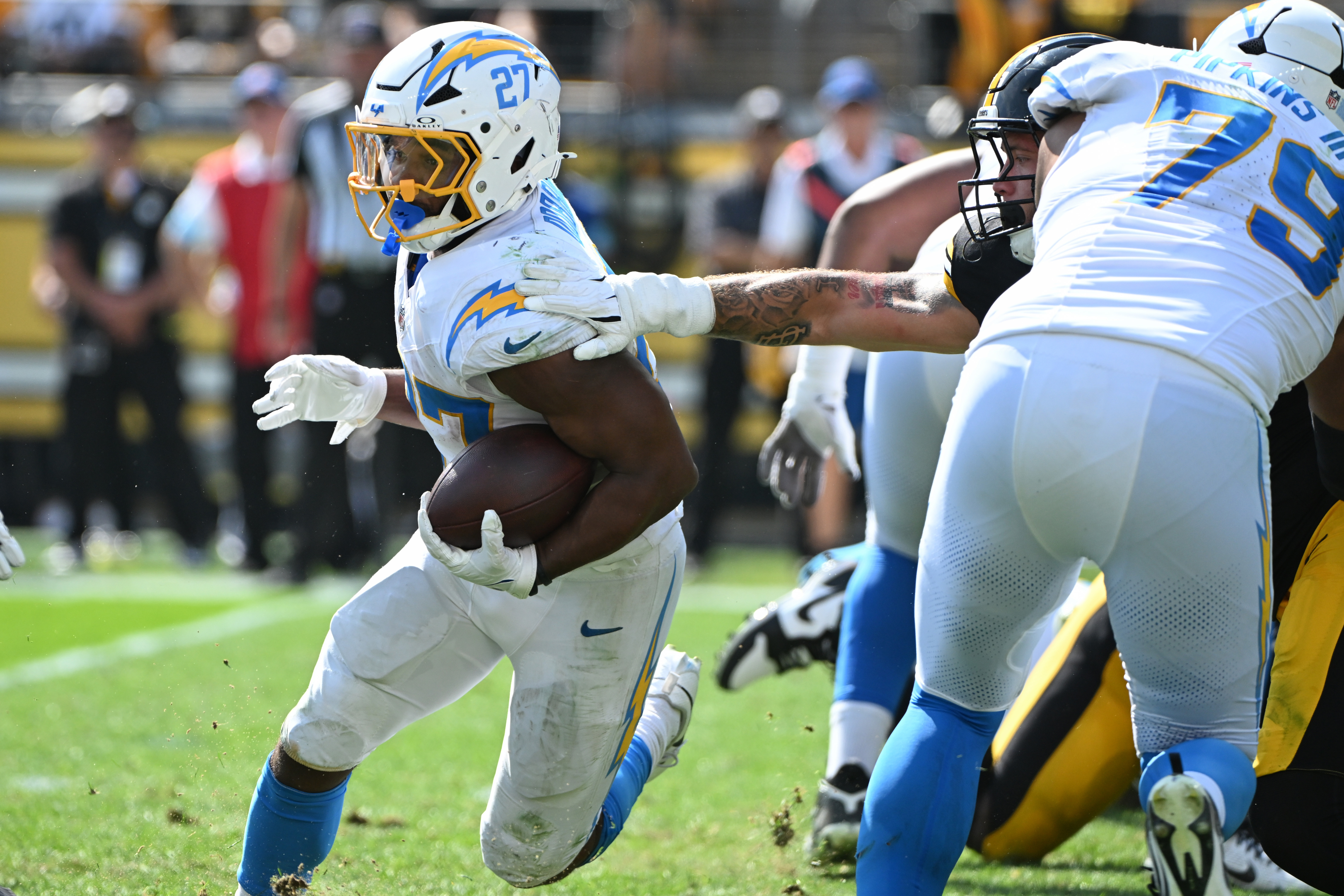 Sep 22, 2024; Pittsburgh, Pennsylvania, USA; Los Angeles Chargers running back J.K. Dobbins (27) gains yardage against the Pittsburgh Steelers during the third quarter at Acrisure Stadium. Mandatory Credit: Barry Reeger-Imagn Images