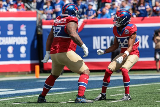 Sep 8, 2024; East Rutherford, New Jersey, USA; New York Giants defensive tackle Dexter Lawrence II (97) celebrates his sack with cornerback Nick McCloud (44) during the first quarter against the Minnesota Vikings at MetLife Stadium. Mandatory Credit: Vincent Carchietta-Imagn Images