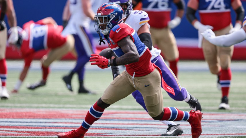 Sep 8, 2024; East Rutherford, New Jersey, USA; New York Giants wide receiver Malik Nabers (1) gains yards after catch during the first half against the Minnesota Vikings at MetLife Stadium. Mandatory Credit: Vincent Carchietta-Imagn Images