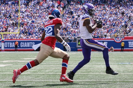 Sep 8, 2024; East Rutherford, New Jersey, USA; Minnesota Vikings wide receiver Jordan Addison (3) catches the ball in front of New York Giants cornerback Dru Phillips (22) during the first half at MetLife Stadium. Mandatory Credit: Vincent Carchietta-Imagn Images