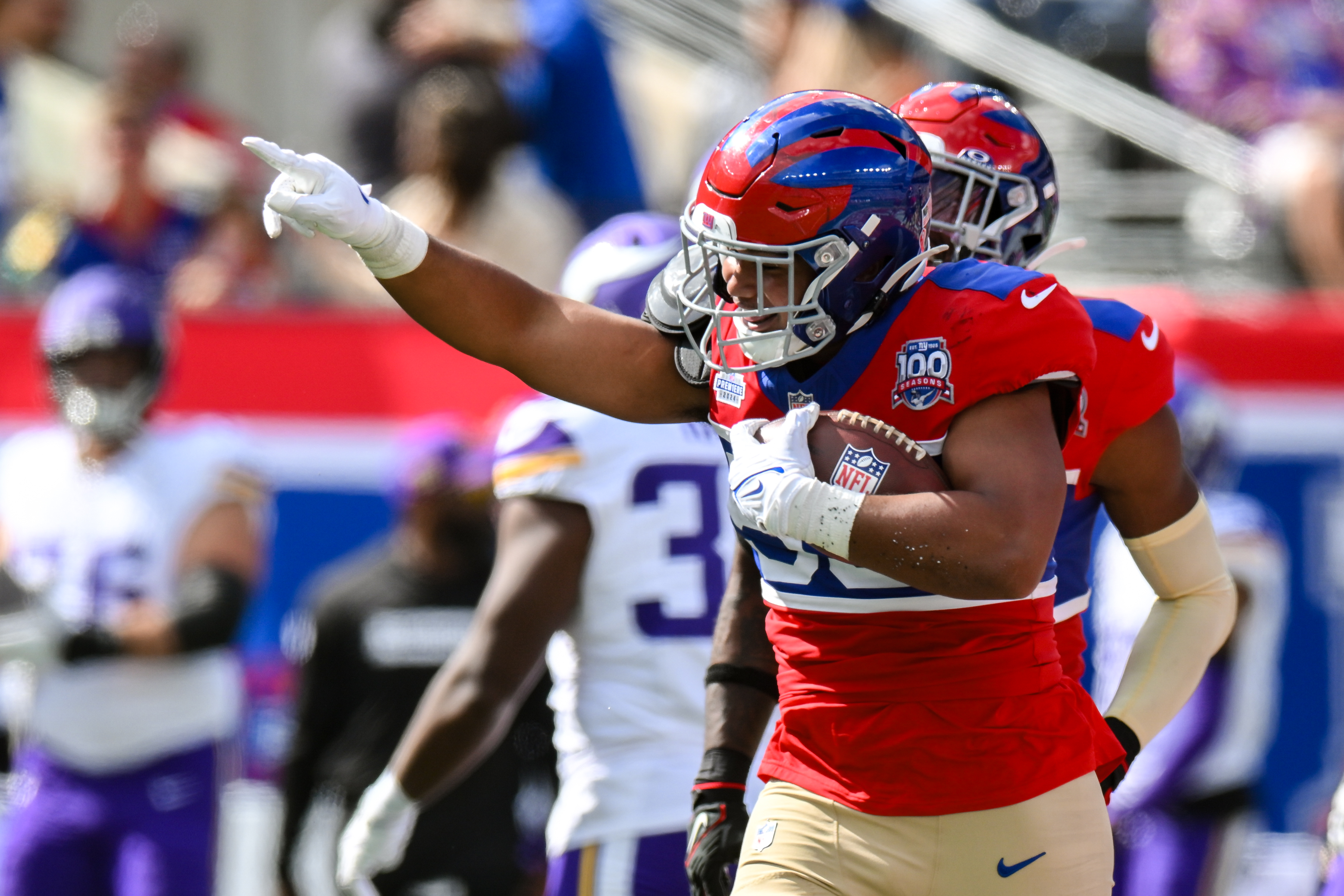 Sep 8, 2024; East Rutherford, New Jersey, USA; New York Giants linebacker Darius Muasau (53) reacts after an interception against the Minnesota Vikings during the second half at MetLife Stadium. Mandatory Credit: John Jones-Imagn Images