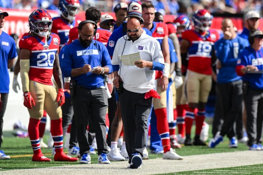 Sep 8, 2024; East Rutherford, New Jersey, USA; New York Giants head coach Brian Dabol looks over his play sheet during the second half against the Minnesota Vikings at MetLife Stadium. Mandatory Credit: John Jones-Imagn Images