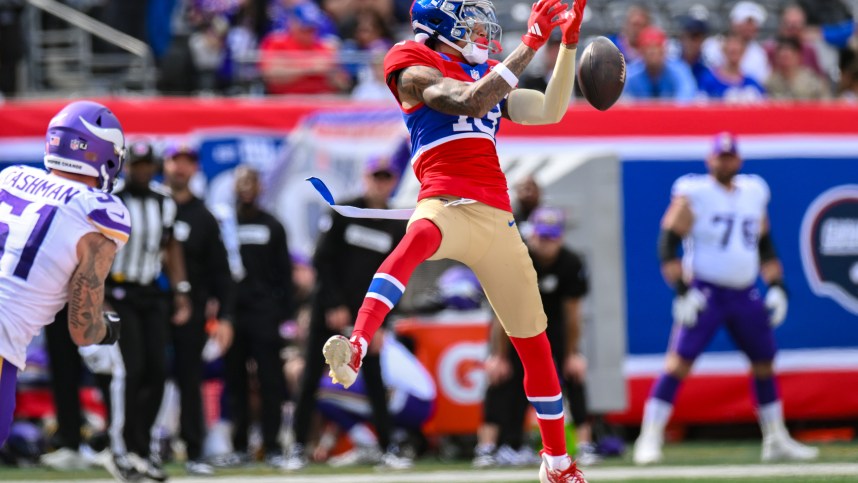 Sep 8, 2024; East Rutherford, New Jersey, USA; New York Giants wide receiver Jalin Hyatt (13) is unable to catch a pass as Minnesota Vikings linebacker Blake Cashman (51) pursues during the second half at MetLife Stadium. Mandatory Credit: John Jones-Imagn Images