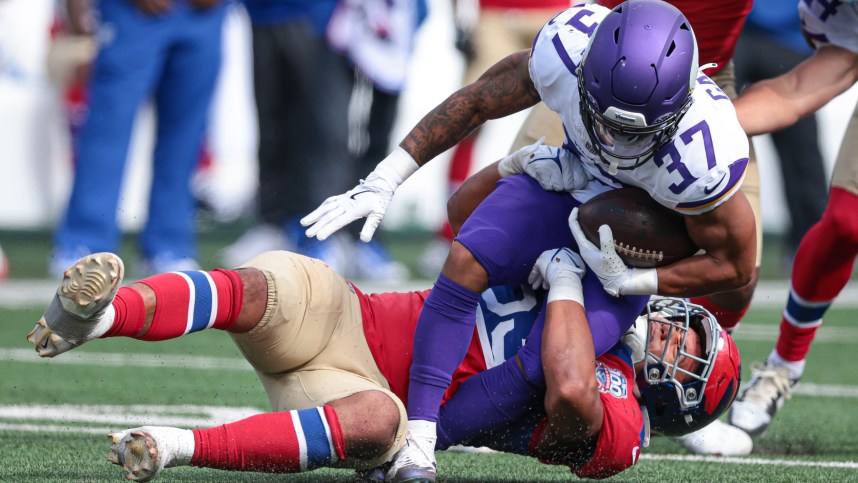 Sep 8, 2024; East Rutherford, New Jersey, USA; Minnesota Vikings running back Miles Gaskin (37) is tackled by New York Giants linebacker Darius Muasau (53) during the second half at MetLife Stadium. Mandatory Credit: Vincent Carchietta-Imagn Images