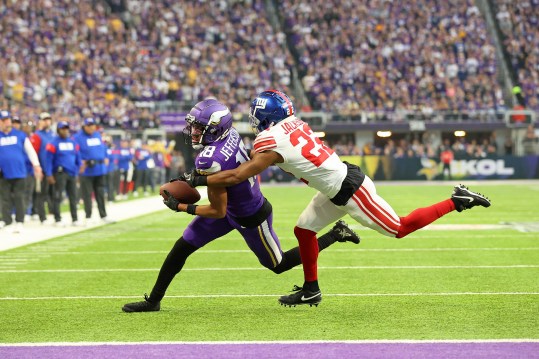 Jan 15, 2023; Minneapolis, Minnesota, USA; Minnesota Vikings wide receiver Justin Jefferson (18) runs with the ball after making a catch while defended by New York Giants cornerback Adoree' Jackson (22) during the first quarter of a wild card game at U.S. Bank Stadium. Mandatory Credit: Matt Krohn-Imagn Images