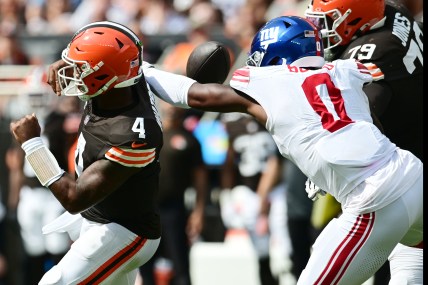 Sep 22, 2024; Cleveland, Ohio, USA; New York Giants linebacker Brian Burns (0) strip sacks Cleveland Browns quarterback Deshaun Watson (4) during the first half at Huntington Bank Field. Mandatory Credit: Ken Blaze-Imagn Images