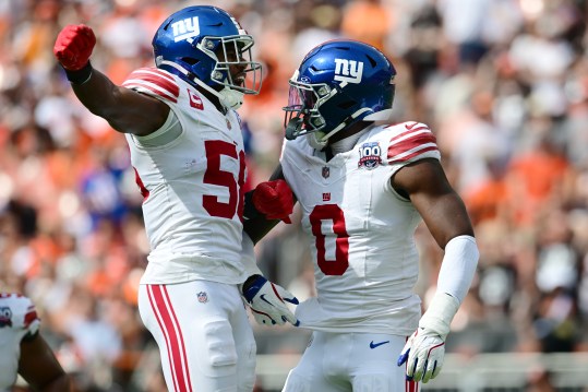 Sep 22, 2024; Cleveland, Ohio, USA; New York Giants linebacker Bobby Okereke (58) and linebacker Brian Burns (0) celebrate after Burns strip sacked Cleveland Browns quarterback Deshaun Watson (not pictured) during the first half at Huntington Bank Field. Mandatory Credit: Ken Blaze-Imagn Images