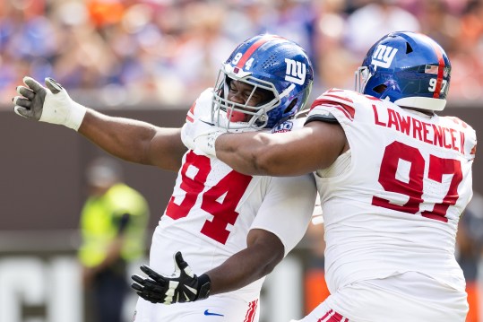 Sep 22, 2024; Cleveland, Ohio, USA; New York Giants defensive tackle Dexter Lawrence II (97) congratulates defensive tackle Elijah Chatman (94) on his sack against the Cleveland Browns during the first quarter at Huntington Bank Field. Mandatory Credit: Scott Galvin-Imagn Images