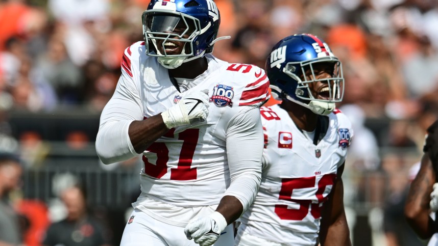 Sep 22, 2024; Cleveland, Ohio, USA; New York Giants linebacker Bobby Okereke (58) and New York Giants linebacker Azeez Ojulari (51) celebrate after a sack during the first quarter against the Cleveland Browns at Huntington Bank Field. Mandatory Credit: Ken Blaze-Imagn Images