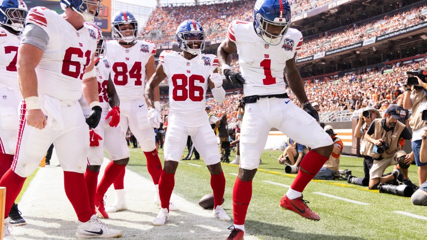 Sep 22, 2024; Cleveland, Ohio, USA; New York Giants wide receiver Malik Nabers (1) celebrates his touchdown with teammates against the Cleveland Browns during the second quarter at Huntington Bank Field. Mandatory Credit: Scott Galvin-Imagn Images