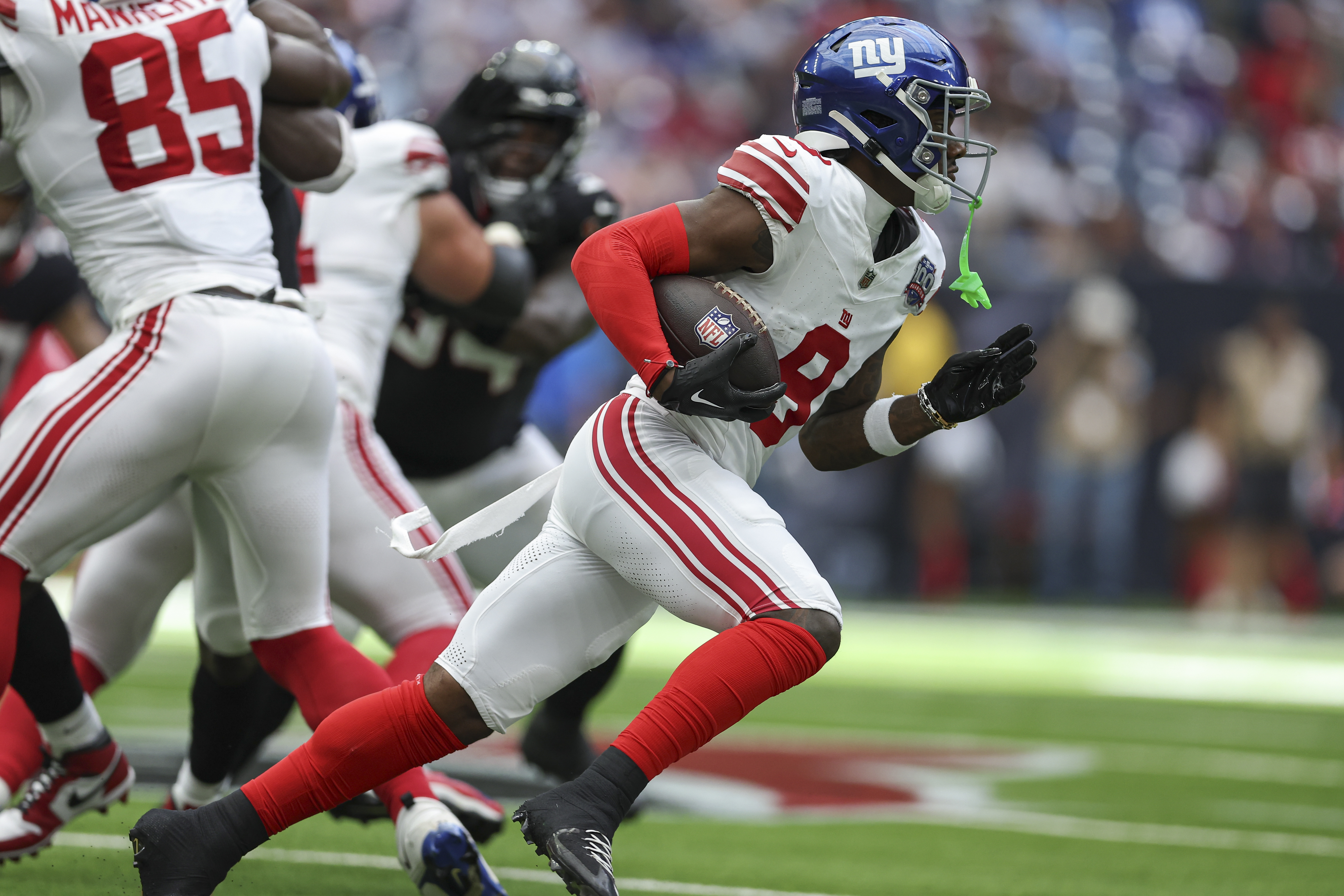 Aug 17, 2024; Houston, Texas, USA; New York Giants wide receiver Malik Nabers (9) runs with the ball during the game against the Houston Texans at NRG Stadium. Mandatory Credit: Troy Taormina-USA TODAY Sports