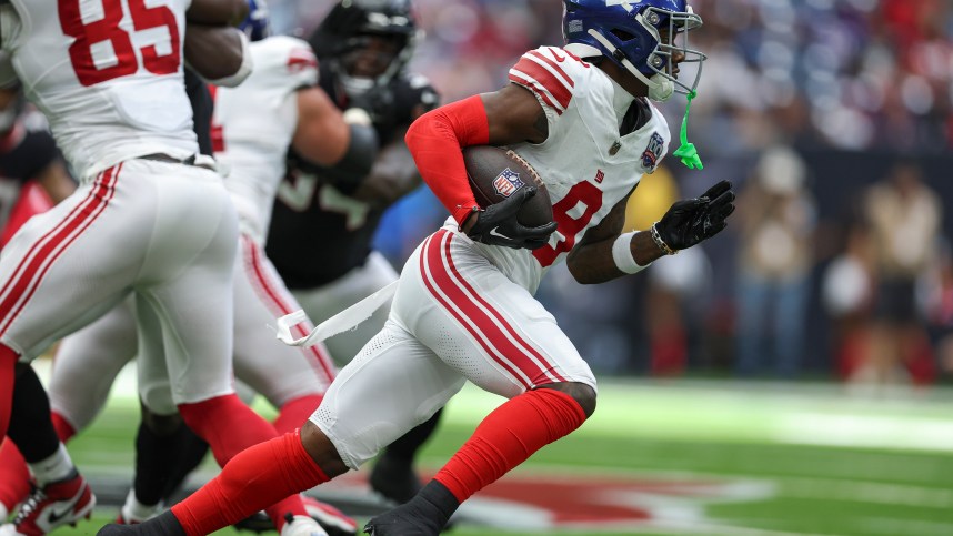 Aug 17, 2024; Houston, Texas, USA; New York Giants wide receiver Malik Nabers (9) runs with the ball during the game against the Houston Texans at NRG Stadium. Mandatory Credit: Troy Taormina-USA TODAY Sports