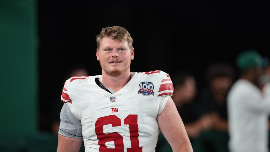 Aug 24, 2024; East Rutherford, New Jersey, USA; New York Giants center John Michael Schmitz Jr. (61) after the game at MetLife Stadium. Mandatory Credit: Vincent Carchietta-Imagn Images