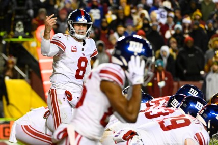 Dec 18, 2022; Landover, Maryland, USA; New York Giants quarterback Daniel Jones (8) gestures at the line of scrimmage against the Washington Commanders during the second half at FedExField. Mandatory Credit: Brad Mills-Imagn Images