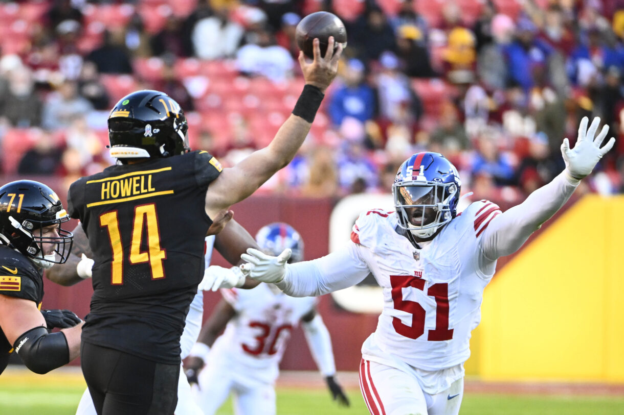 Nov 19, 2023; Landover, Maryland, USA; New York Giants linebacker Azeez Ojulari (51) pressures Washington Commanders quarterback Sam Howell (14) during the second half at FedExField. Mandatory Credit: Brad Mills-Imagn Images