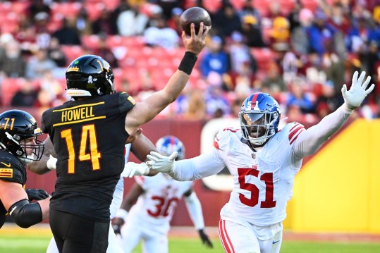 Nov 19, 2023; Landover, Maryland, USA; New York Giants linebacker Azeez Ojulari (51) pressures Washington Commanders quarterback Sam Howell (14) during the second half at FedExField. Mandatory Credit: Brad Mills-Imagn Images