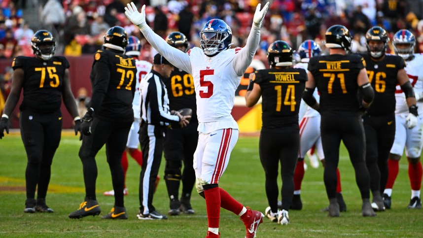 Nov 19, 2023; Landover, Maryland, USA; New York Giants linebacker Kayvon Thibodeaux (5) celebrate after a sack against the Washington Commandersduring the second half at FedExField. Mandatory Credit: Brad Mills-Imagn Images