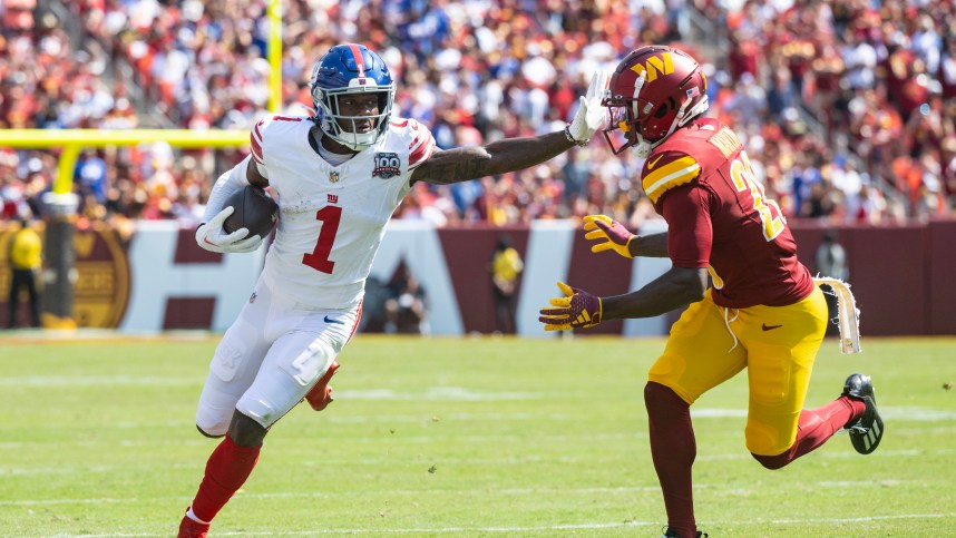 Sep 15, 2024; Landover, Maryland, USA; New York Giants wide receiver Malik Nabers (1) runs down the field pressured by Washington Comanders defensive back Juan Martin (20) in the first half at Commanders Field. Mandatory Credit: Luke Johnson-Imagn Images