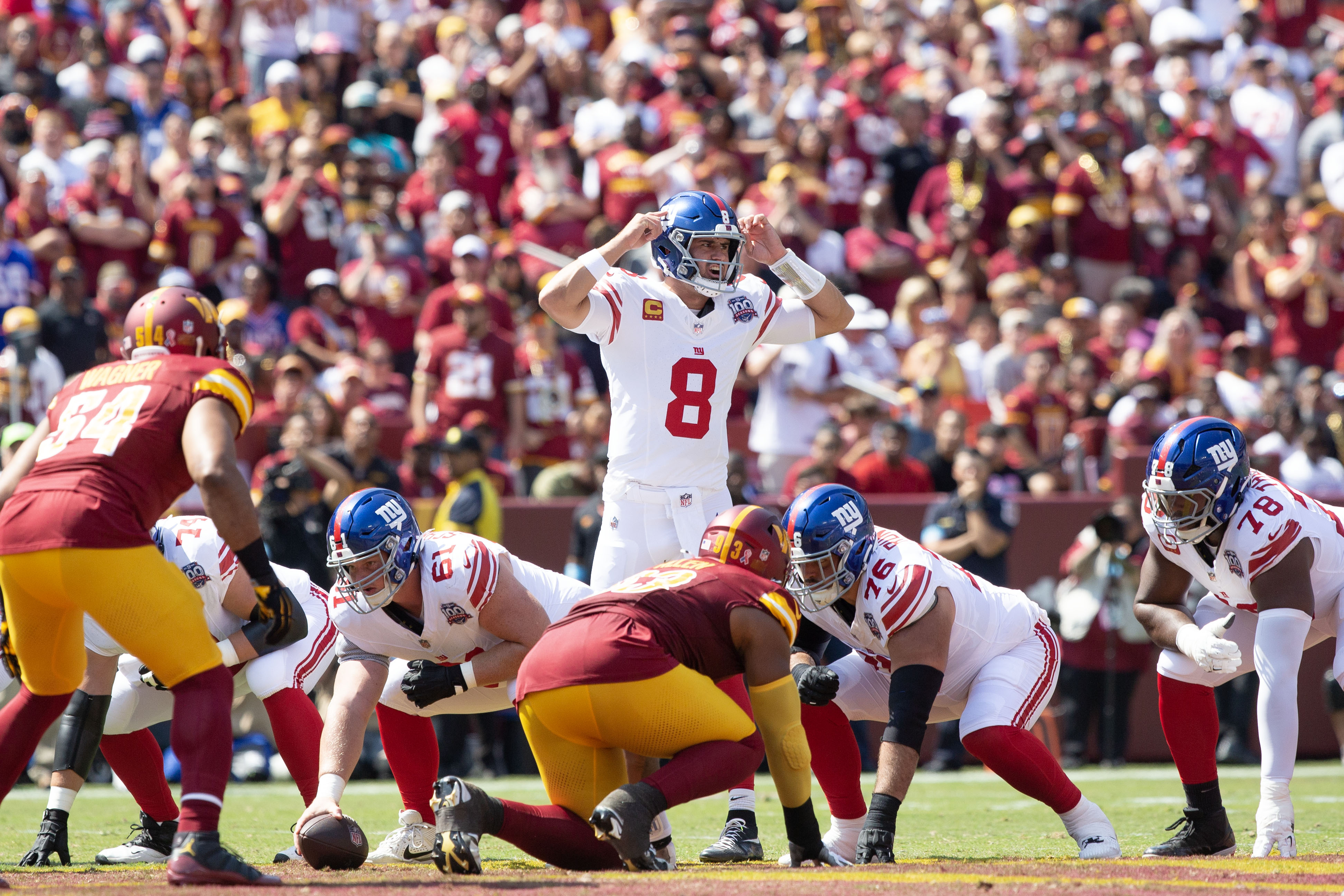 Sep 15, 2024; Landover, Maryland, USA; New York Giants quarterback Daniel Jones (8) calls a play in the first half against the New York Giants at Commanders Field. Mandatory Credit: Luke Johnson-Imagn Images