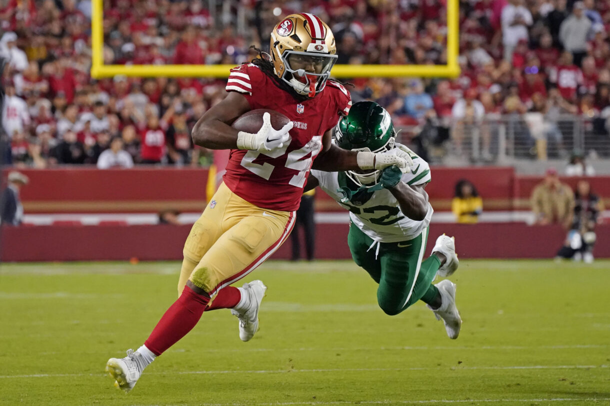 Sep 9, 2024; Santa Clara, California, USA; San Francisco 49ers running back Jordan Mason (24) rushes by New York Jets safety Tony Adams (22) in the fourth quarter at Levi