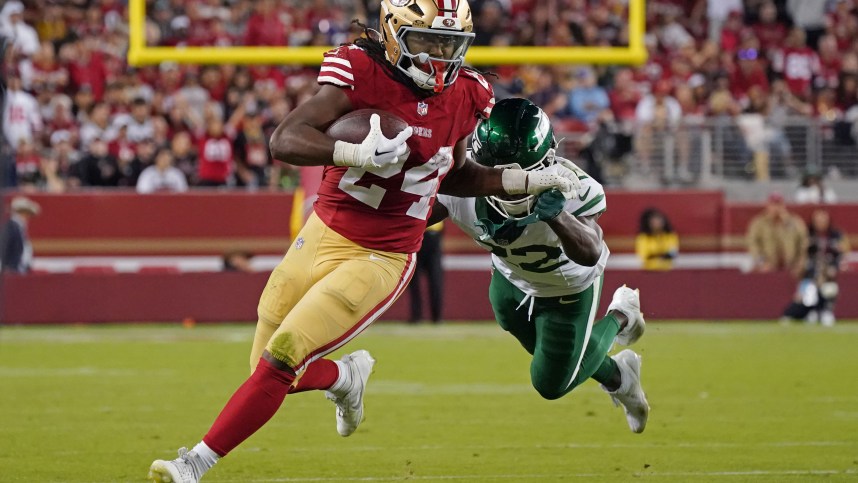 Sep 9, 2024; Santa Clara, California, USA; San Francisco 49ers running back Jordan Mason (24) rushes by New York Jets safety Tony Adams (22) in the fourth quarter at Levi's Stadium. Mandatory Credit: David Gonzales-Imagn Images