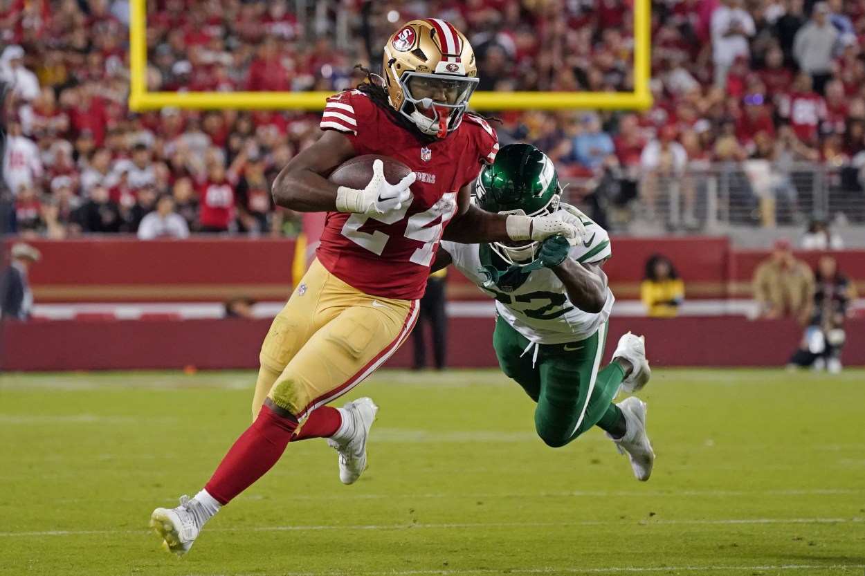 Sep 9, 2024; Santa Clara, California, USA; San Francisco 49ers running back Jordan Mason (24) rushes by New York Jets safety Tony Adams (22) in the fourth quarter at Levi's Stadium. Mandatory Credit: David Gonzales-Imagn Images