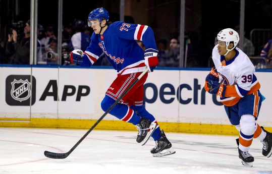 Sep 24, 2024; New York, New York, USA; New York Rangers center Matt Rempe (73) skates away from New York Islanders defenseman Isaiah George (39) during the first period at Madison Square Garden. Mandatory Credit: Danny Wild-Imagn Images