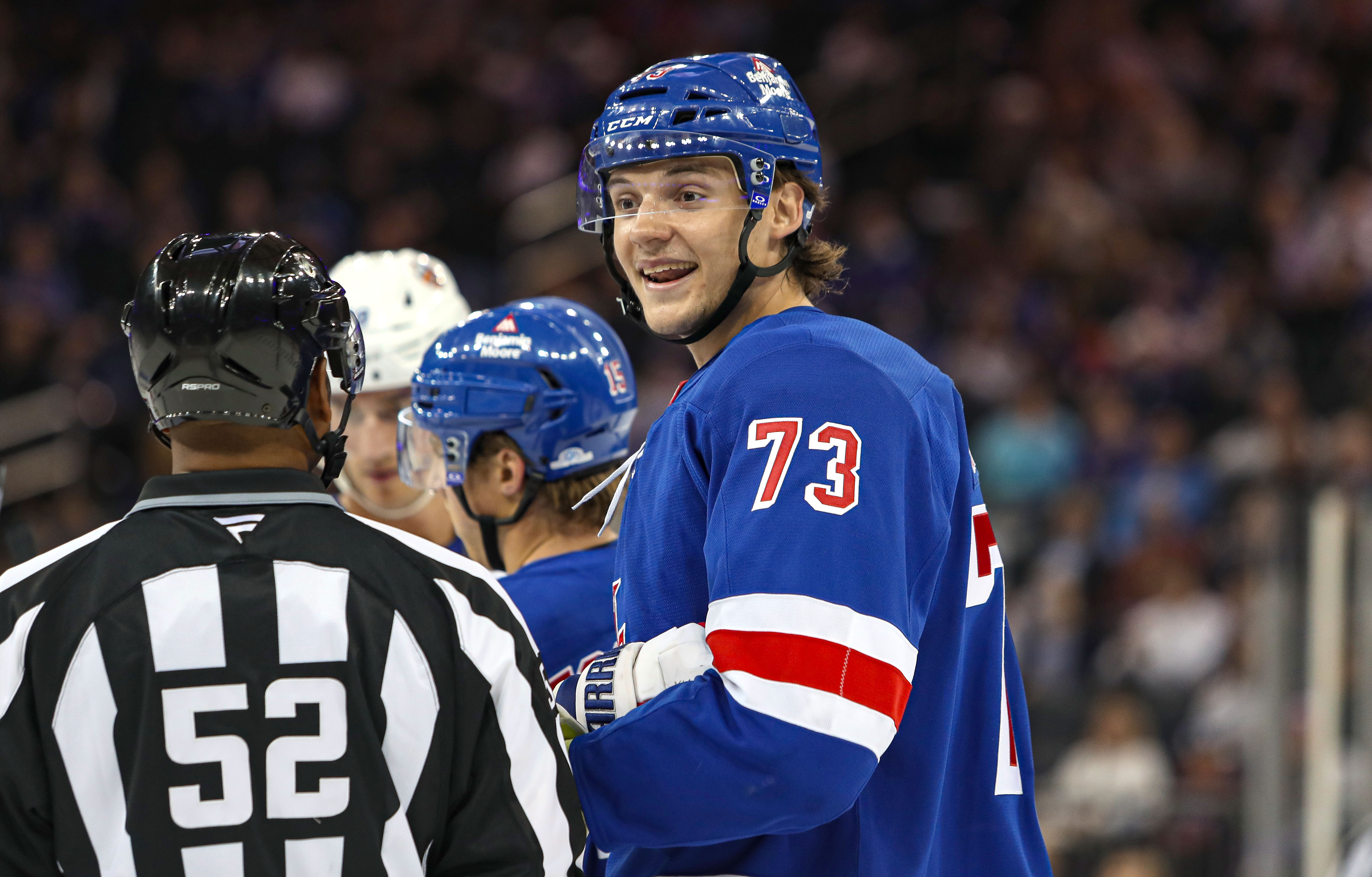 Sep 24, 2024; New York, New York, USA; New York Rangers center Matt Rempe (73) speaks with a linesman  during the second period against the New York Islanders at Madison Square Garden. Mandatory Credit: Danny Wild-Imagn Images