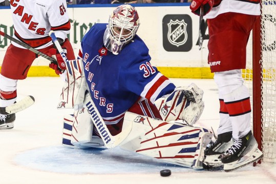 May 5, 2024; New York, New York, USA; New York Rangers goaltender Igor Shesterkin (31) makes a save in the third period against the Carolina Hurricanes in game one of the second round of the 2024 Stanley Cup Playoffs at Madison Square Garden. Mandatory Credit: Wendell Cruz-Imagn Images