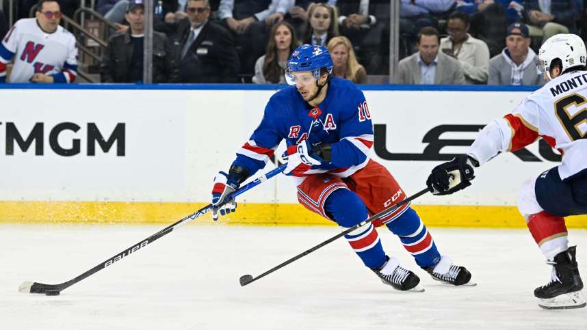 May 30, 2024; New York, New York, USA; New York Rangers left wing Artemi Panarin (10) skates with the puck as Florida Panthers defenseman Brandon Montour (62) defends during the third period in game five of the Eastern Conference Final of the 2024 Stanley Cup Playoffs at Madison Square Garden. Mandatory Credit: Dennis Schneidler-Imagn Images