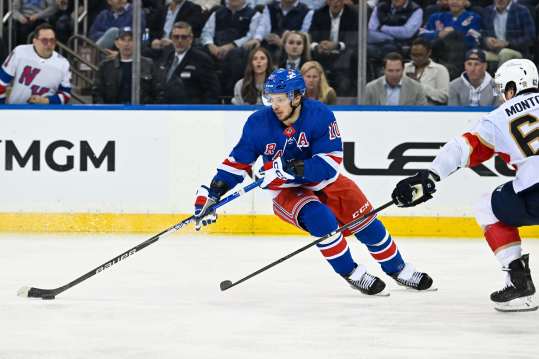 May 30, 2024; New York, New York, USA; New York Rangers left wing Artemi Panarin (10) skates with the puck as Florida Panthers defenseman Brandon Montour (62) defends during the third period in game five of the Eastern Conference Final of the 2024 Stanley Cup Playoffs at Madison Square Garden. Mandatory Credit: Dennis Schneidler-Imagn Images