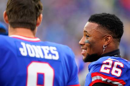 New York Giants running back Saquon Barkley (26) and quarterback Daniel Jones (8) talk on the sideline as the fourth quarter ends during the Giants win over the Chicago Bears at MetLife Stadium on Sunday, Oct. 2, 2022, in East Rutherford.