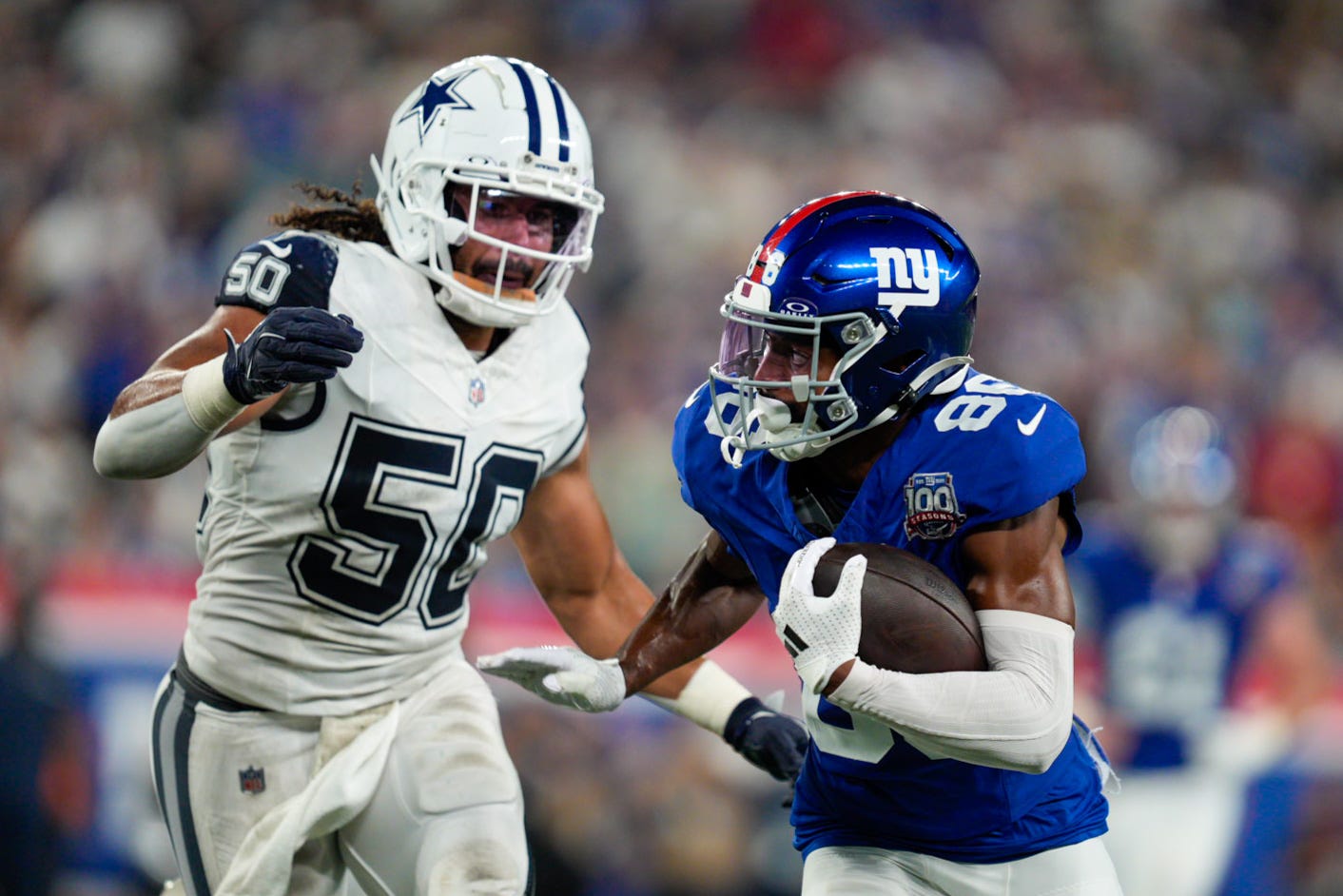 Sep 26, 2024; East Rutherford, NJ, US; New York Giants wide receiver Darius Slayton (86) runs with the ball after a catch while being chased by Dallas Cowboys linebacker Eric Kendricks (50) at MetLife Stadium. Mandatory Credit: Julian Guadalupe-NorthJersey.com